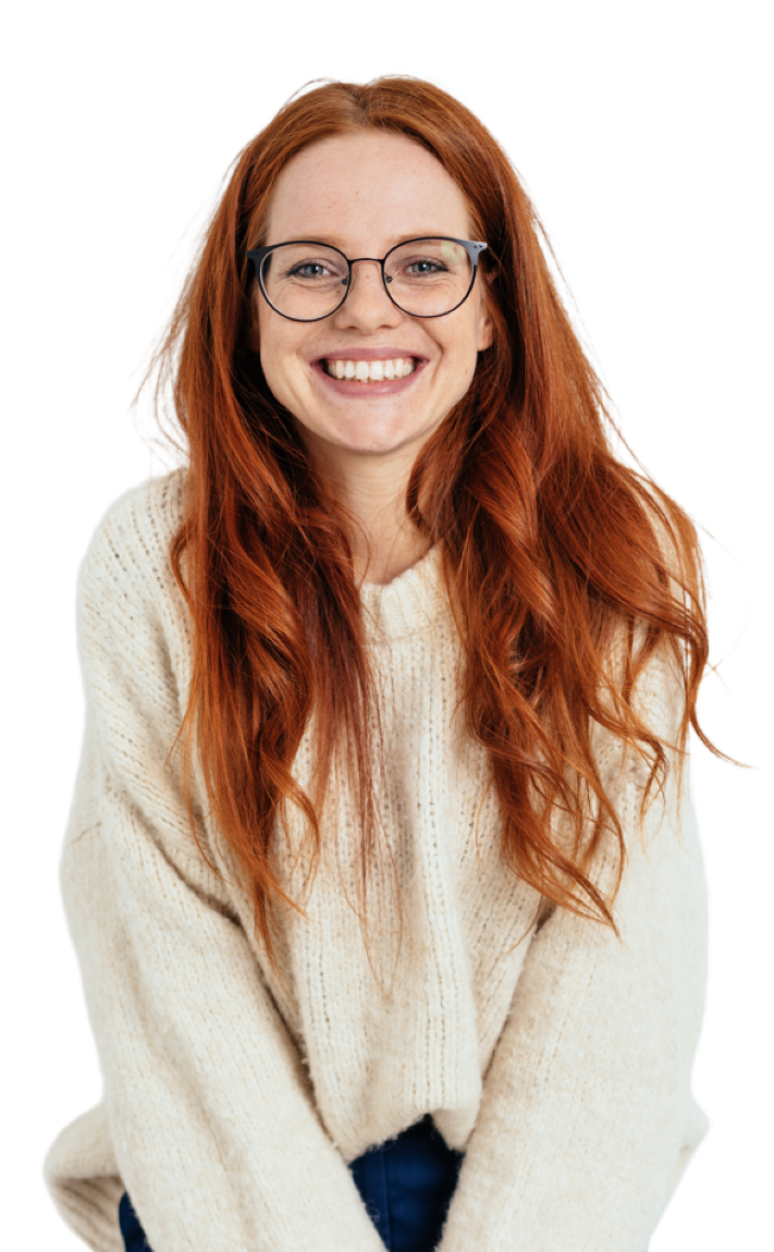 a young woman looking happy wearing her new glasses after her eye test in Wednesbury