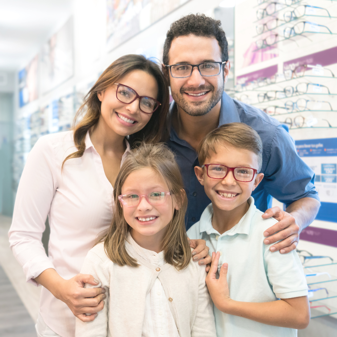 Family at opticians together wearing glasses
